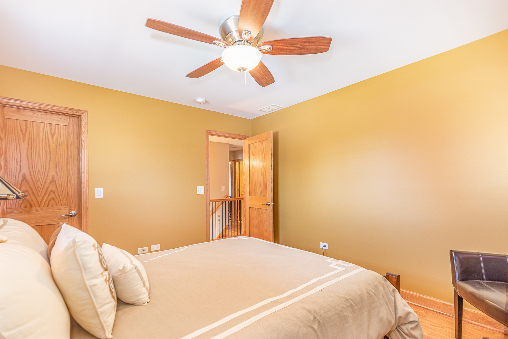 181 Queenswood Road Bolingbrook, IL 60440 - Photo 29 of 46 a bedroom with a bed and a chandelier
