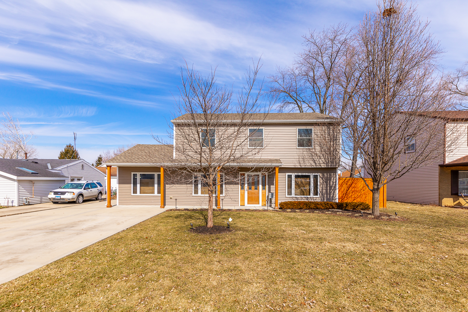 181 Queenswood Road Bolingbrook, IL 60440 - Photo 4 of 46 a front view of a building with large trees