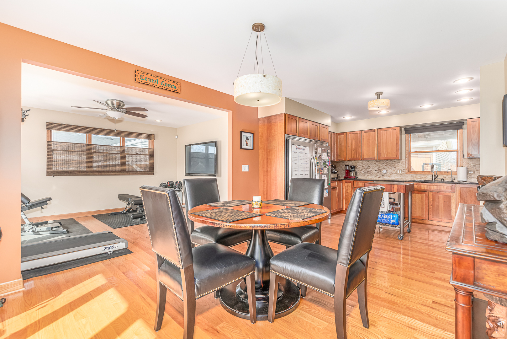 181 Queenswood Road Bolingbrook, IL 60440 - Photo 8 of 46 a dining room with furniture a chandelier and wooden floor