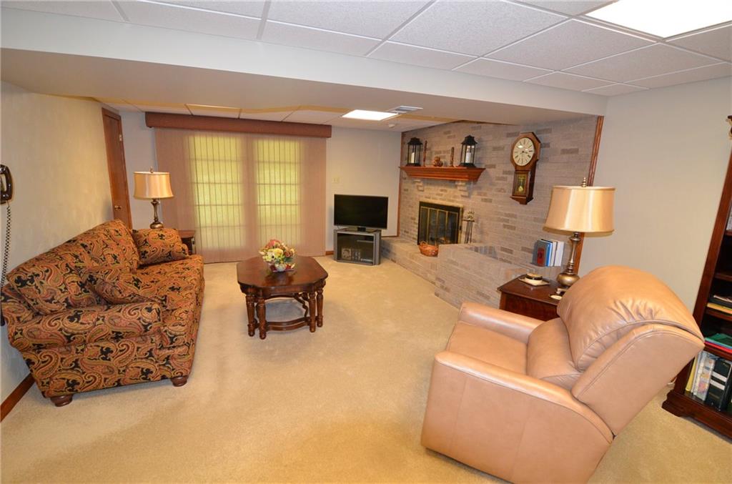 111 Hampton Court Butler, PA 16002 - Photo 21 of 25 a living room with furniture and a fireplace