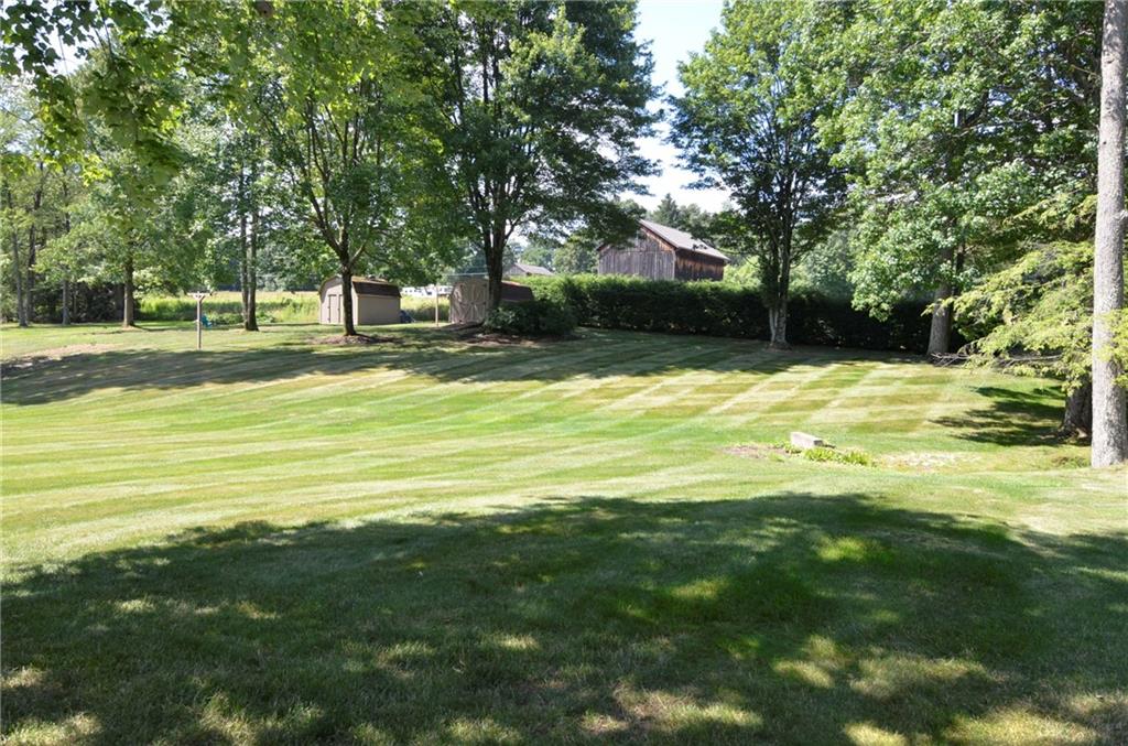 111 Hampton Court Butler, PA 16002 - Photo 4 of 25 a swimming pool with trees in the background