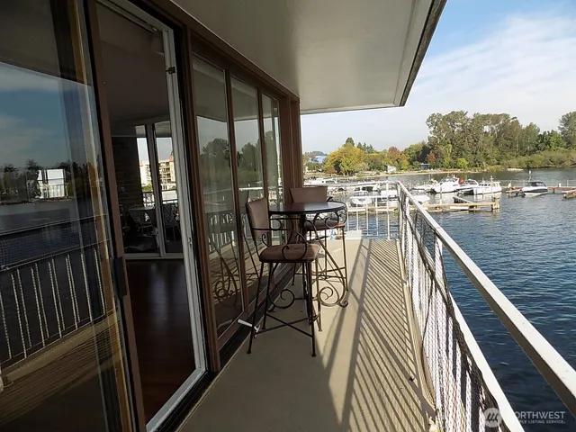 a view of a balcony with chairs