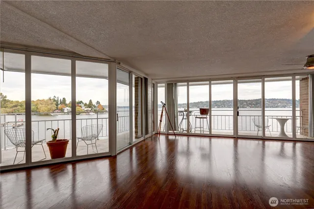 a view of an entryway with wooden floor