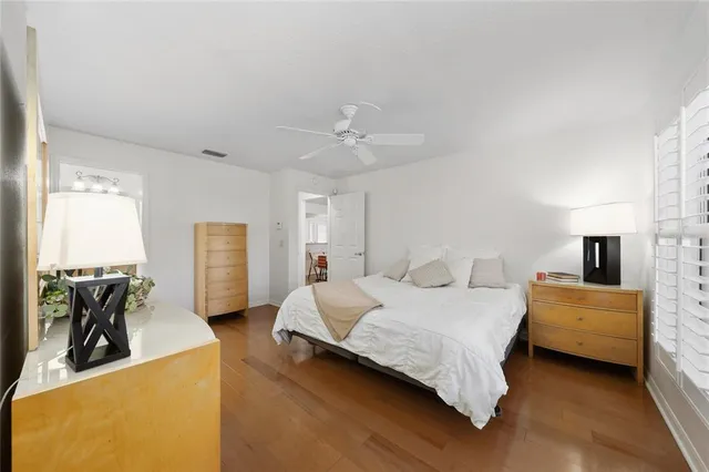 a bedroom with a bed and a couch