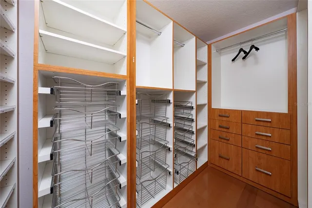 a view of walk in closet and window