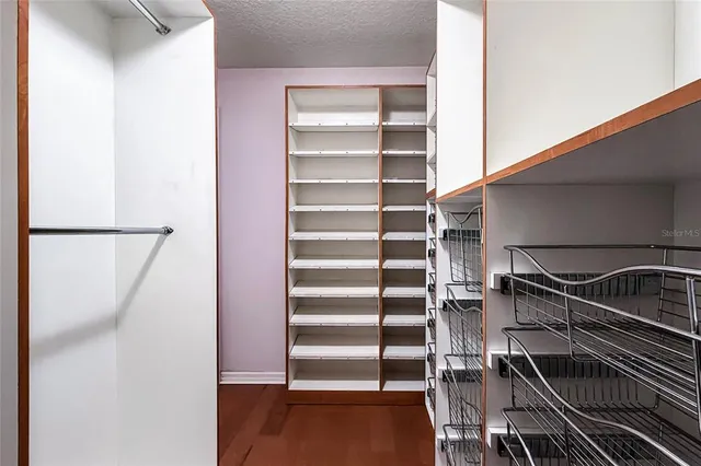 a view of staircase with white walls and a window