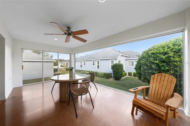 a dining room with furniture and wooden floor
