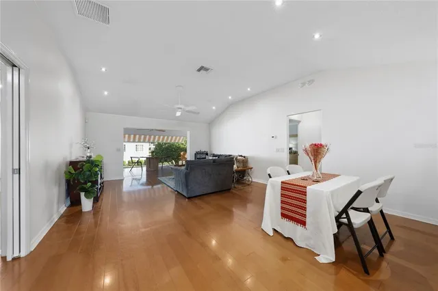 a living room with furniture potted plant and a window