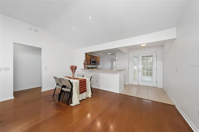 a work room with furniture and a wooden floor