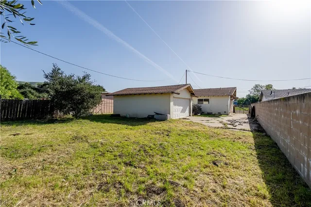 a house view with a backyard space