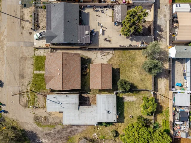 an aerial view of residential houses with outdoor space