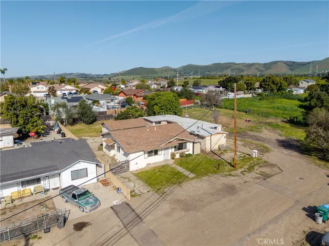 an aerial view of a house with a lake view