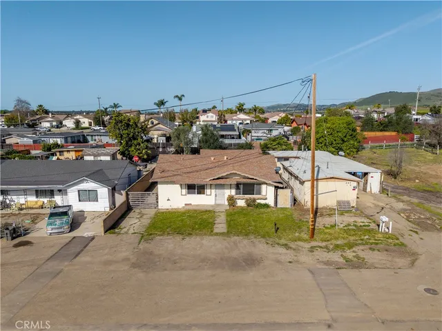 a view of multiple houses with a street