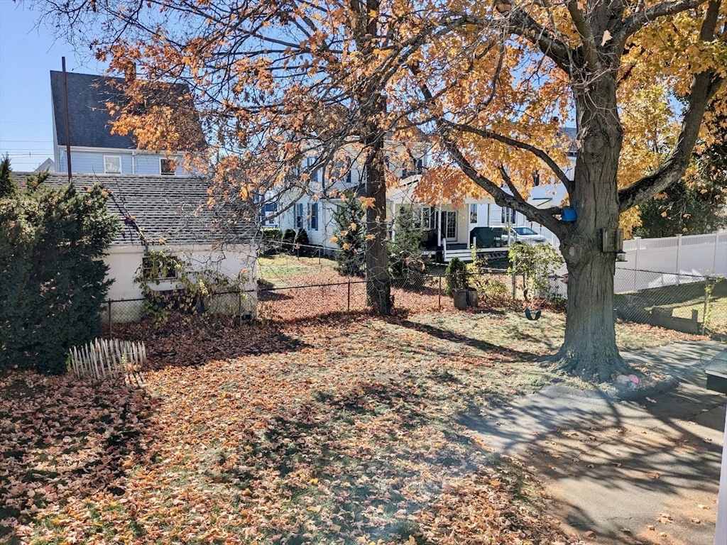 161 Webster Street, Unit 2 Malden, MA 02148 - Photo 13 of 15 a backyard of a house with a tree