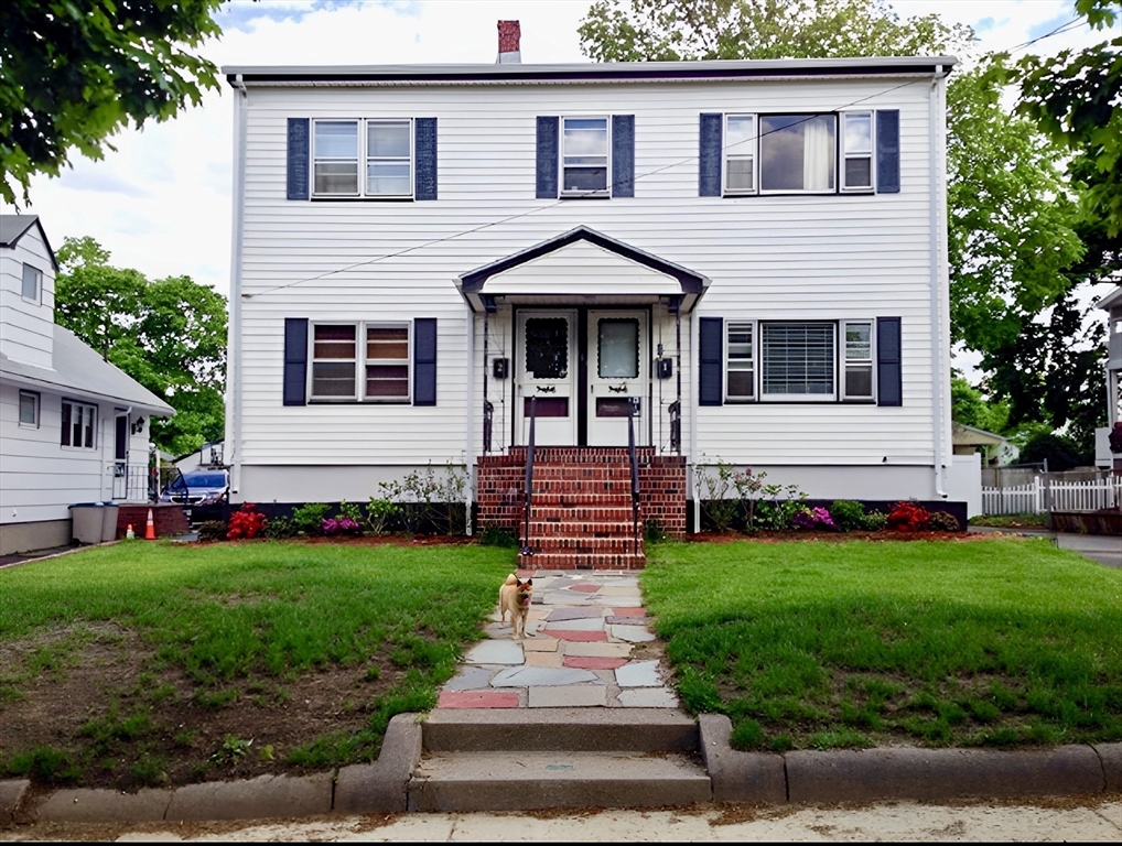 161 Webster Street, Unit 2 Malden, MA 02148 - Photo 14 of 15 a front view of a house with a yard