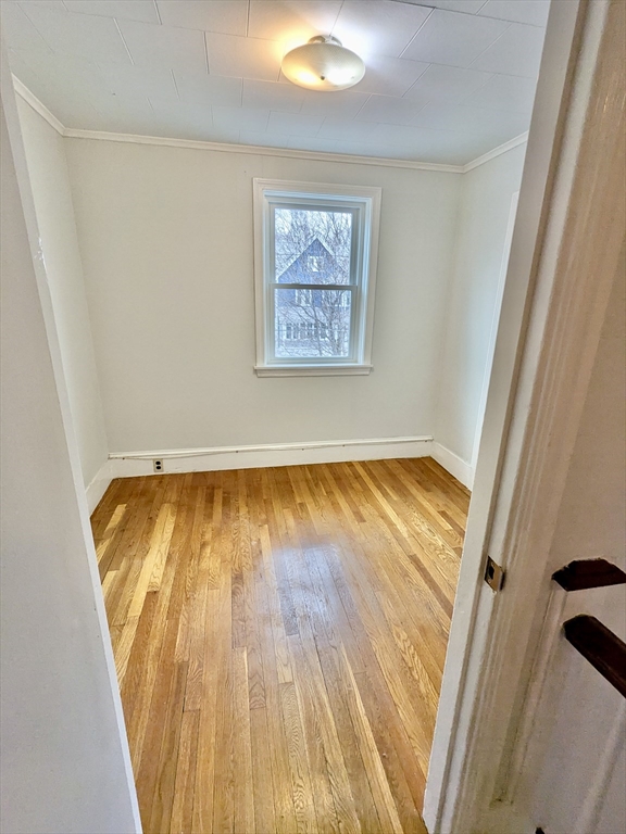 161 Webster Street, Unit 2 Malden, MA 02148 - Photo 9 of 15 a view of a room with wooden floor and pool view