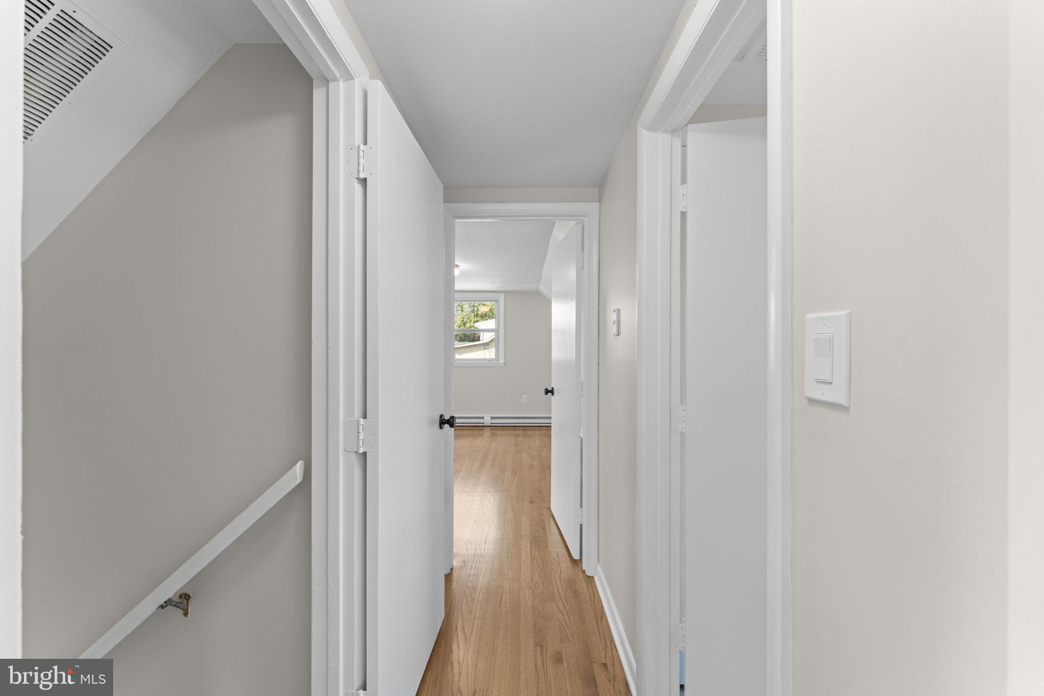 222 Chelsea Road Pasadena, MD 21122 - Photo 30 of 90 Upper hall, natural wood floors