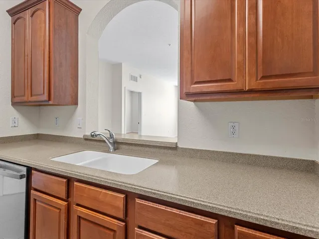 a bathroom with a sink and cabinets