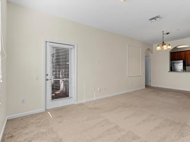 a view of an empty room with a fireplace