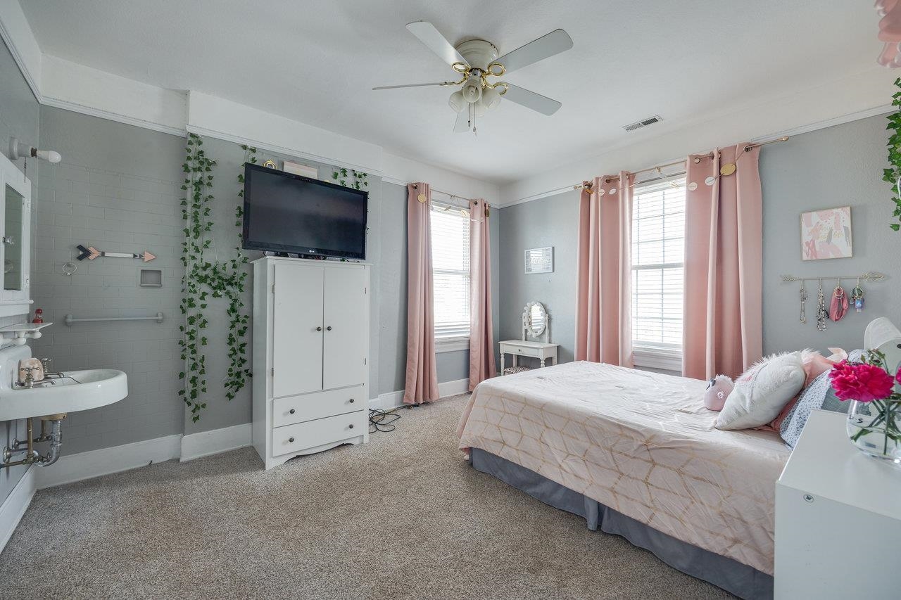 515 Fourth Street Shenandoah, VA 22849 - Photo 27 of 51 a bedroom with a bed and a flat screen tv