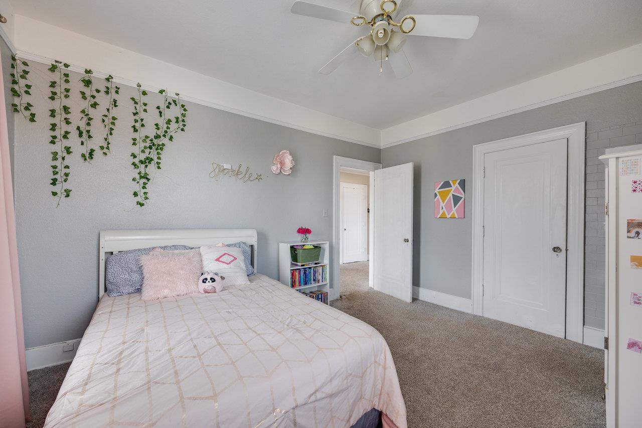 515 Fourth Street Shenandoah, VA 22849 - Photo 28 of 51 a bedroom with a large bed and a chandelier