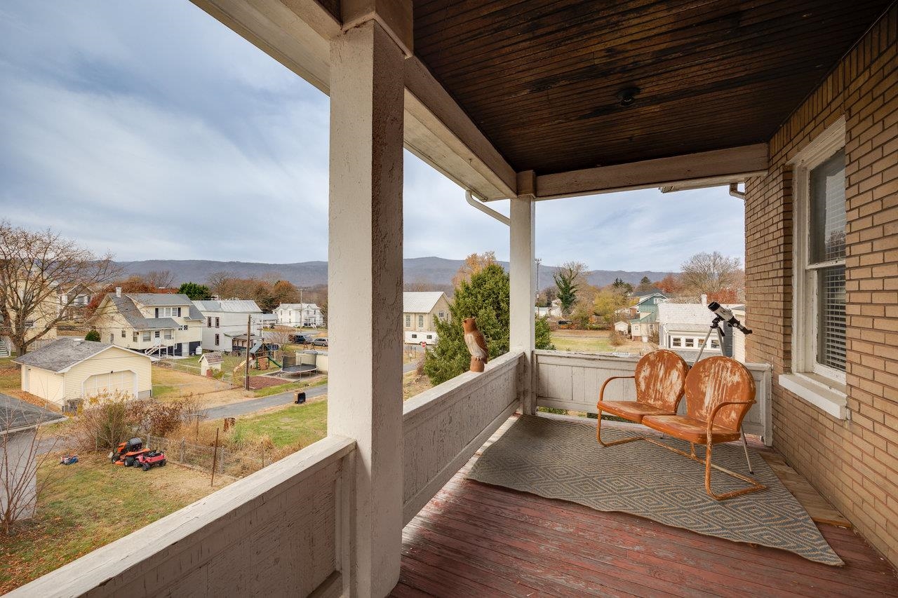 515 Fourth Street Shenandoah, VA 22849 - Photo 33 of 51 a view of a balcony with chair and wooden floor
