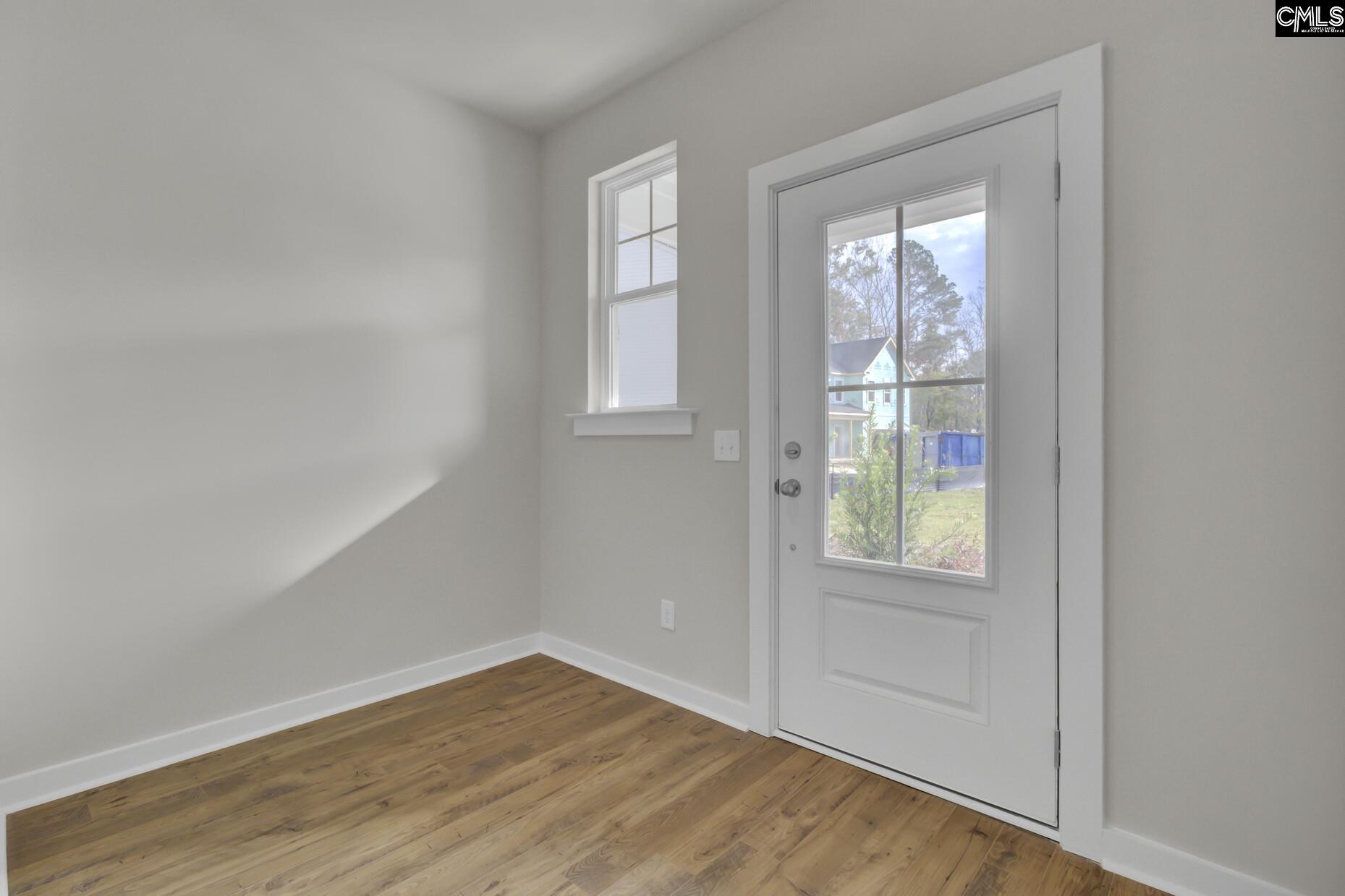 320 Brass Billion Path Lexington, SC 29073 - Photo 5 of 39 an empty room with wooden floor and windows