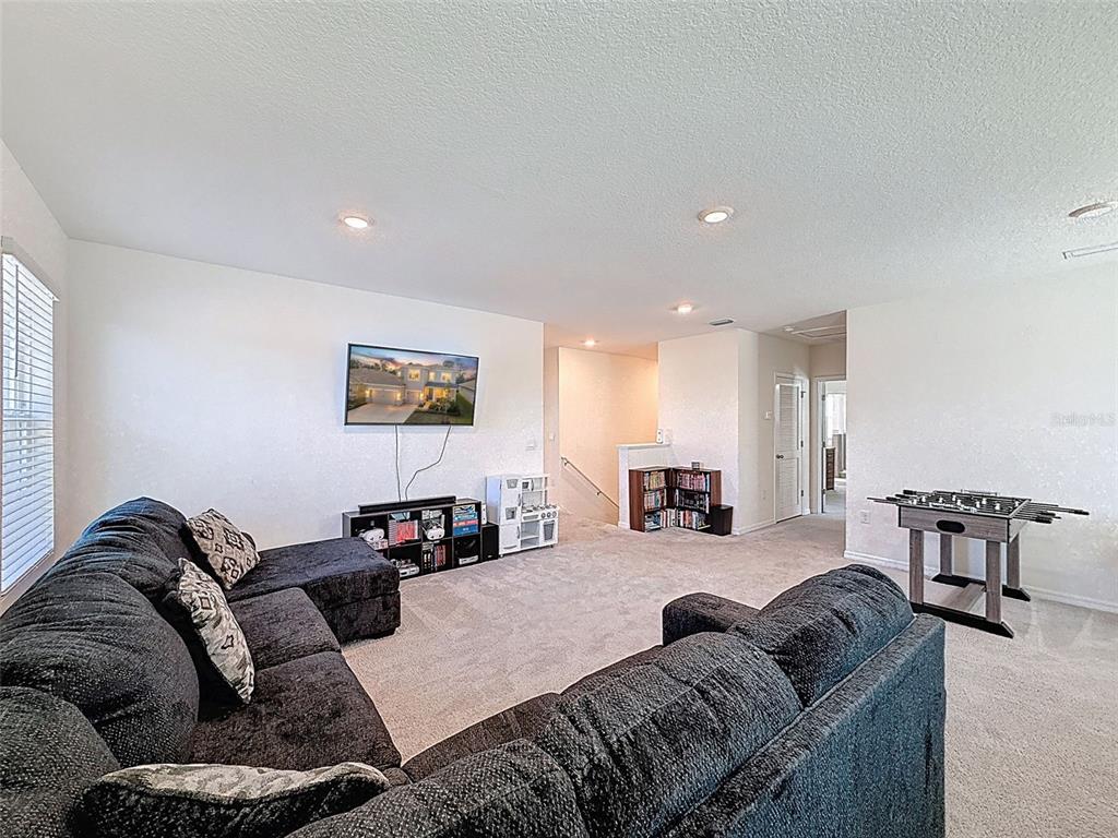 3797 Autumn Amber Dr Spring Hill Spring Hill, FL 34609 - Photo 21 of 44 a living room with furniture a couch and a coffee table