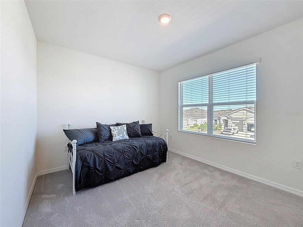 3797 Autumn Amber Dr Spring Hill Spring Hill, FL 34609 - Photo 27 of 44 a living room with furniture and a window