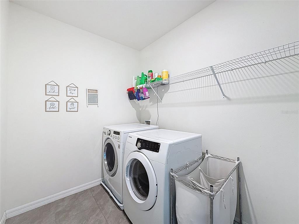 3797 Autumn Amber Dr Spring Hill Spring Hill, FL 34609 - Photo 29 of 44 a utility room with dryer and washer