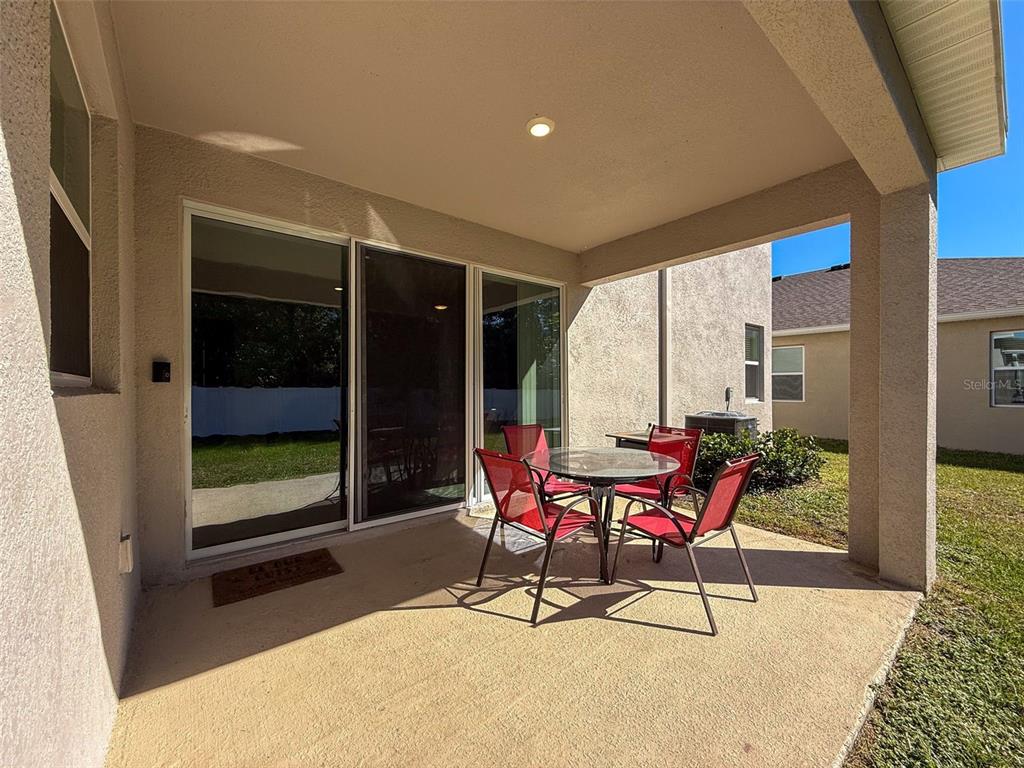 3797 Autumn Amber Dr Spring Hill Spring Hill, FL 34609 - Photo 32 of 44 a bench sitting in front of a building