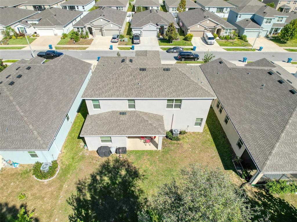 3797 Autumn Amber Dr Spring Hill Spring Hill, FL 34609 - Photo 34 of 44 an aerial view of a house with a swimming pool