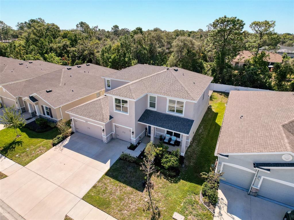 3797 Autumn Amber Dr Spring Hill Spring Hill, FL 34609 - Photo 35 of 44 an aerial view of a house with swimming pool and garden