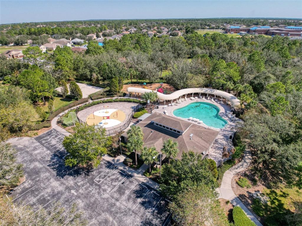 3797 Autumn Amber Dr Spring Hill Spring Hill, FL 34609 - Photo 36 of 44 an aerial view of a house with a garden and lake view