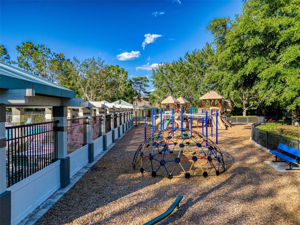 3797 Autumn Amber Dr Spring Hill Spring Hill, FL 34609 - Photo 38 of 44 a view of a porch with furniture and garden