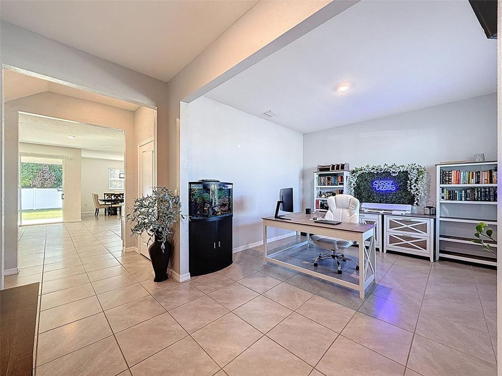 3797 Autumn Amber Dr Spring Hill Spring Hill, FL 34609 - Photo 6 of 44 a living room with furniture and view of kitchen