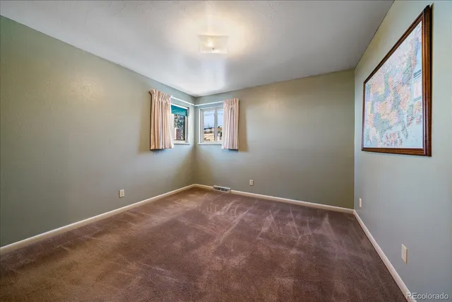 a view of a workspace with furniture