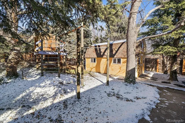 a view of empty room with wooden walls