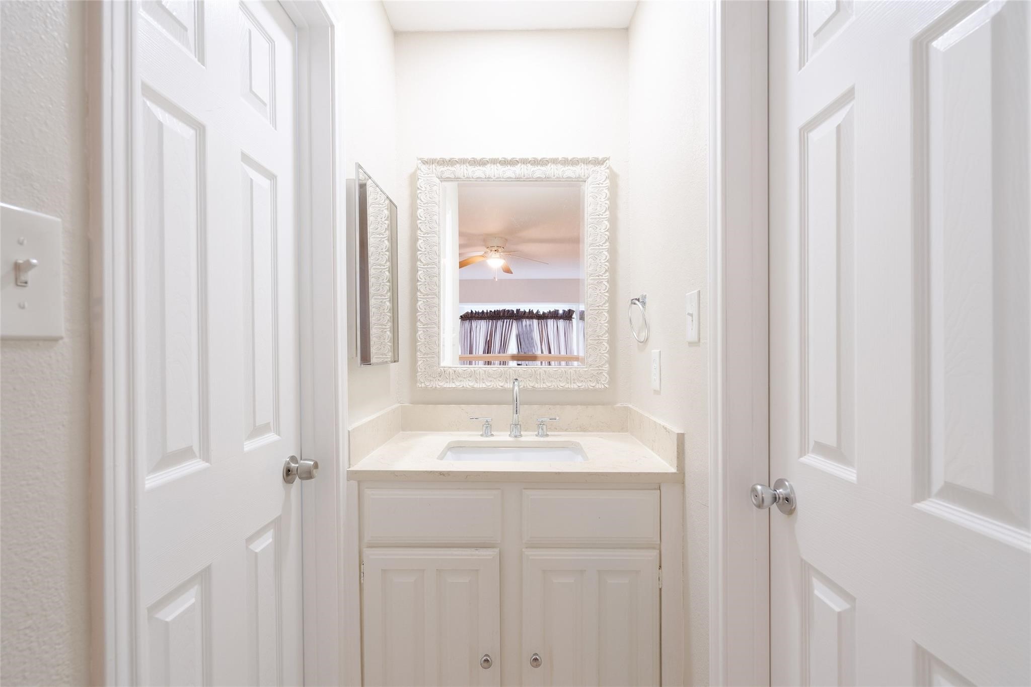 16120 Stuebner Airline Road, Unit 501 Spring, TX 77379 - Photo 19 of 23 a bathroom with a sink and a mirror