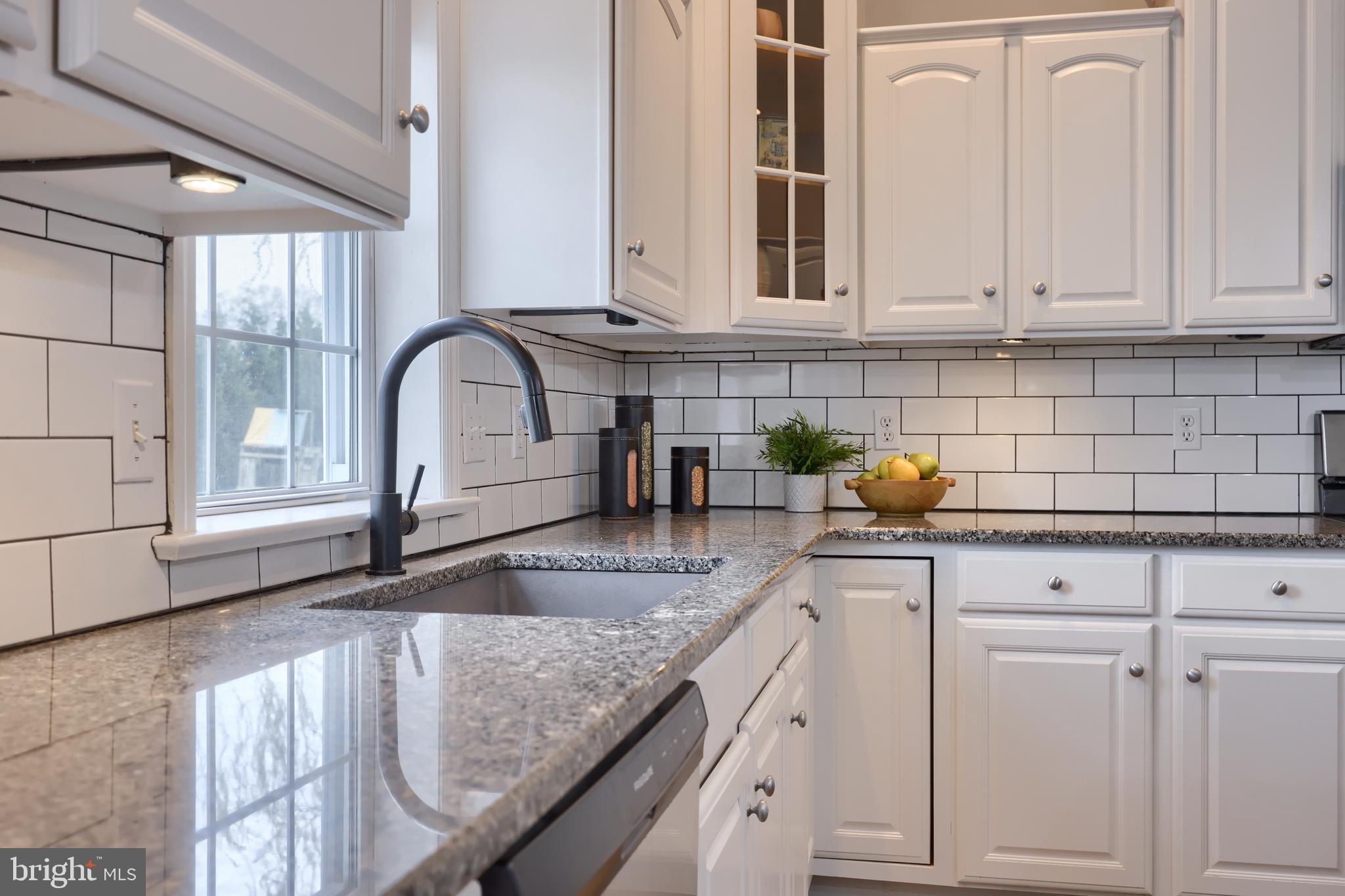 1860 Windy Hill Road Lancaster, PA 17602 - Photo 28 of 71 a kitchen with granite countertop white cabinets and a sink