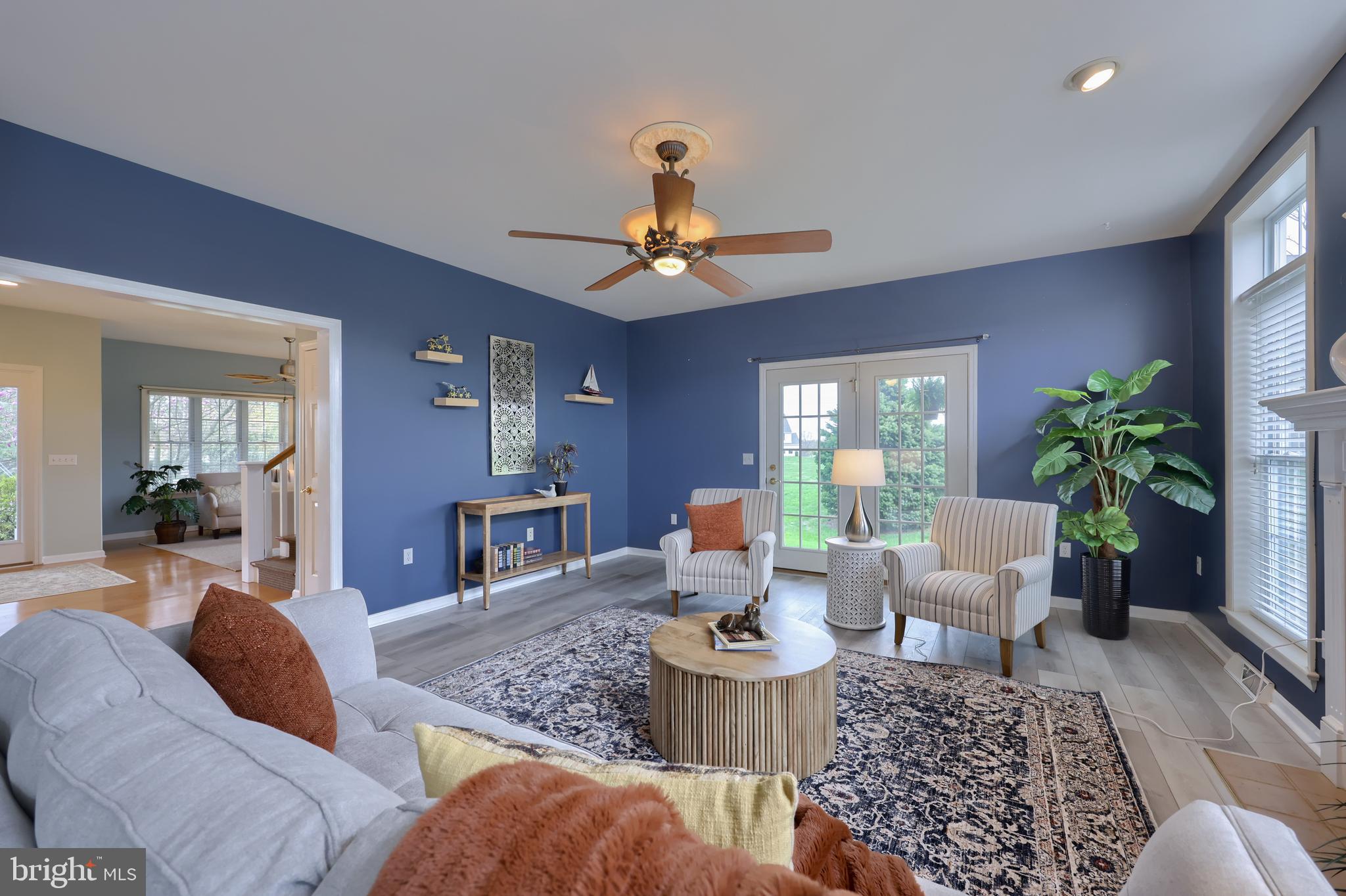 1860 Windy Hill Road Lancaster, PA 17602 - Photo 36 of 71 a living room with furniture a chandelier and a rug