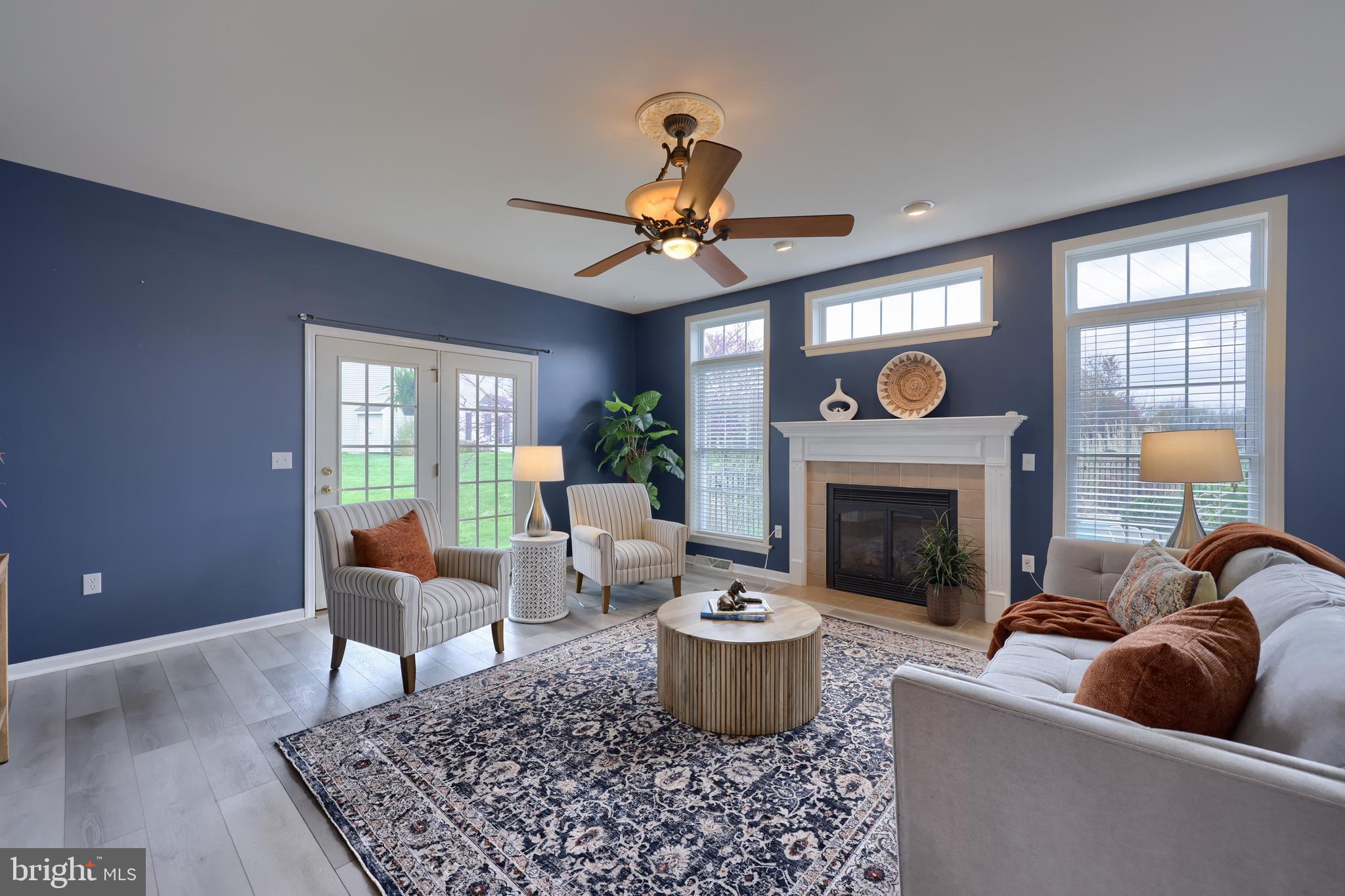 1860 Windy Hill Road Lancaster, PA 17602 - Photo 37 of 71 a living room with furniture a rug and a fireplace