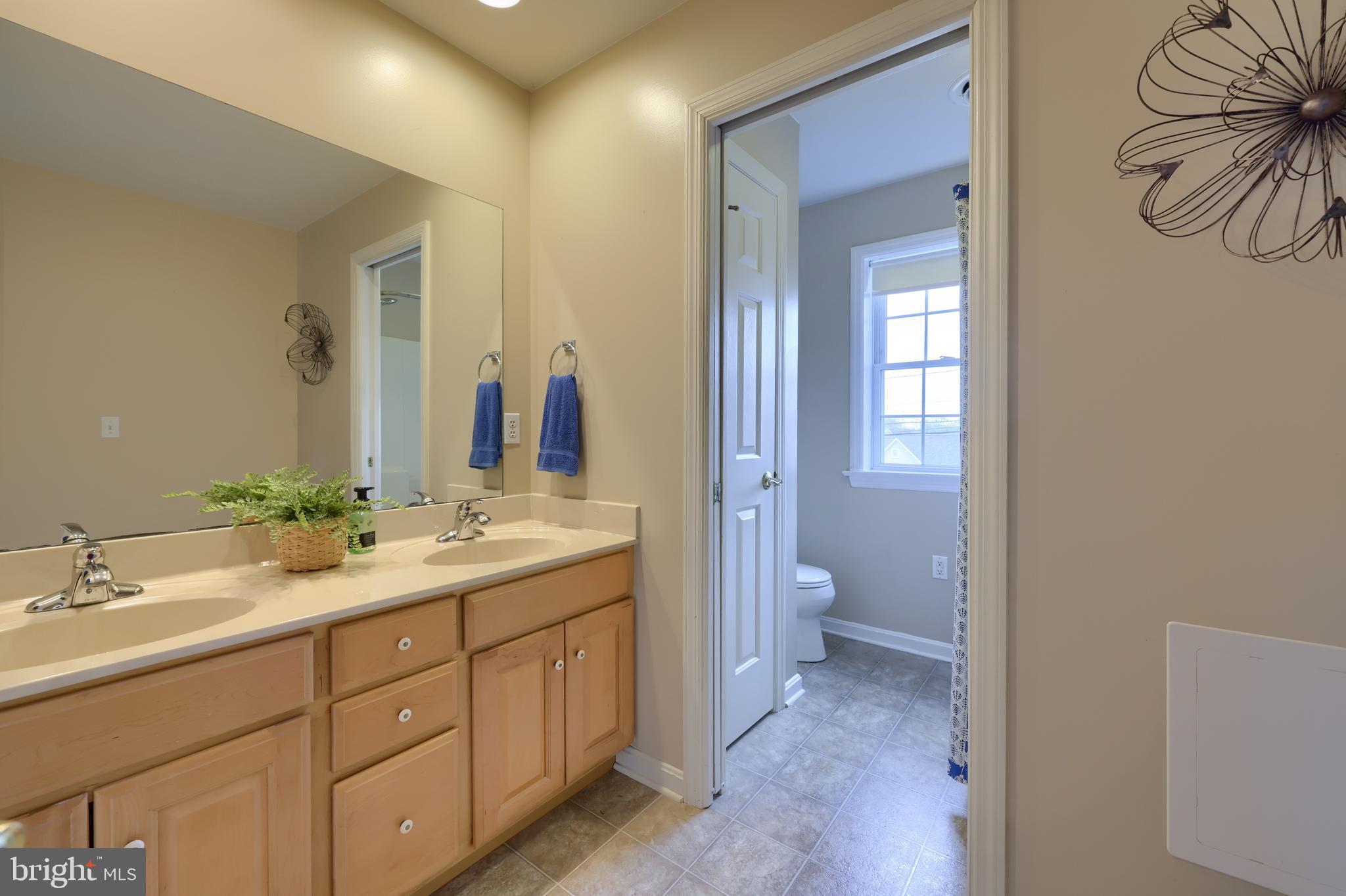 1860 Windy Hill Road Lancaster, PA 17602 - Photo 44 of 71 a bathroom with a double vanity sink and a mirror