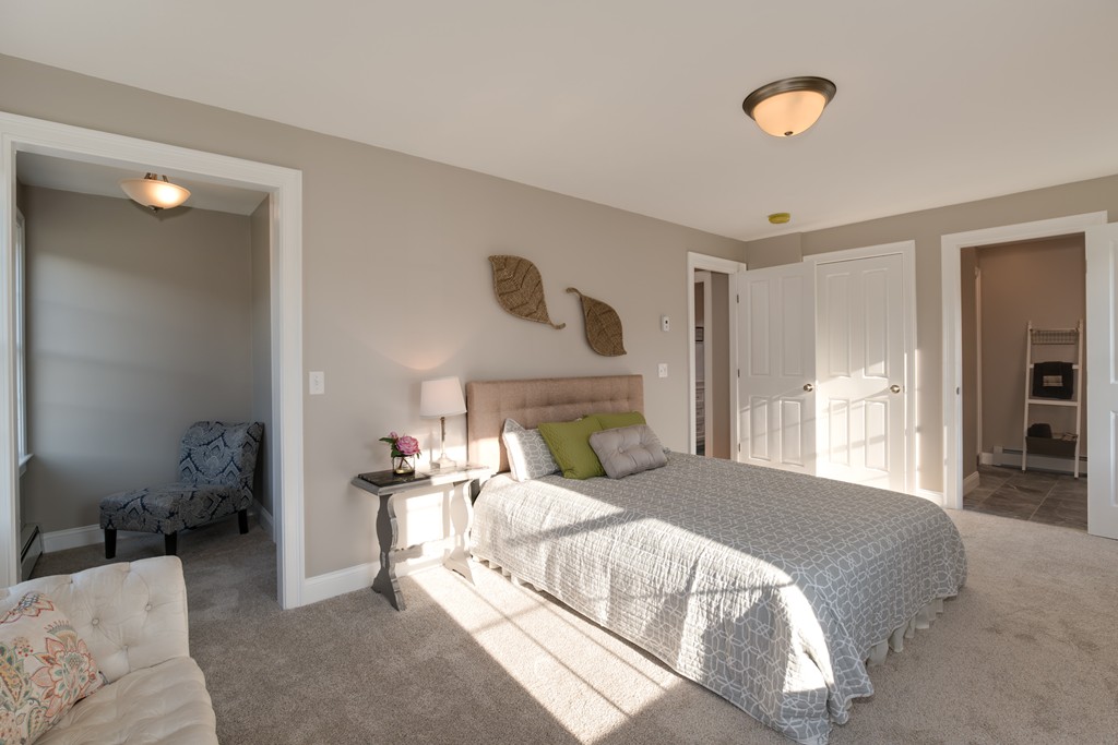 15 Winifreds Way Rutland, MA 01543 - Photo 19 of 30 a bedroom with a bed mirror and a window