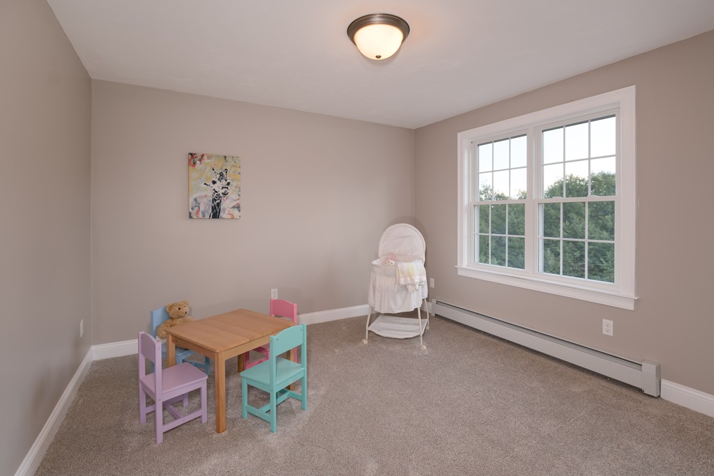 15 Winifreds Way Rutland, MA 01543 - Photo 25 of 30 a living room with table and a window