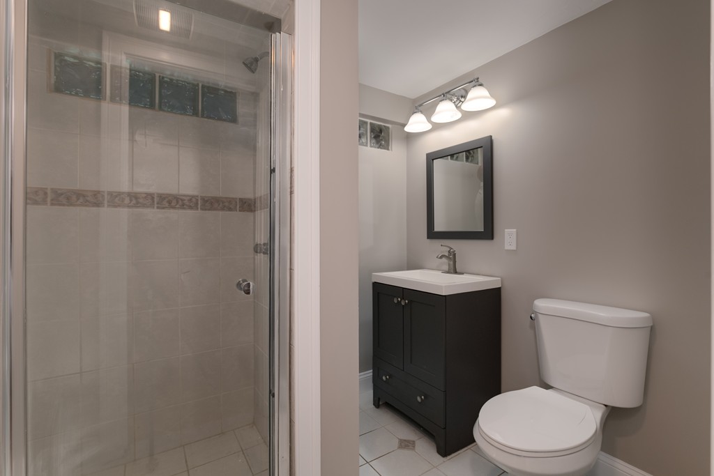 15 Winifreds Way Rutland, MA 01543 - Photo 27 of 30 a bathroom with a toilet a sink and mirror