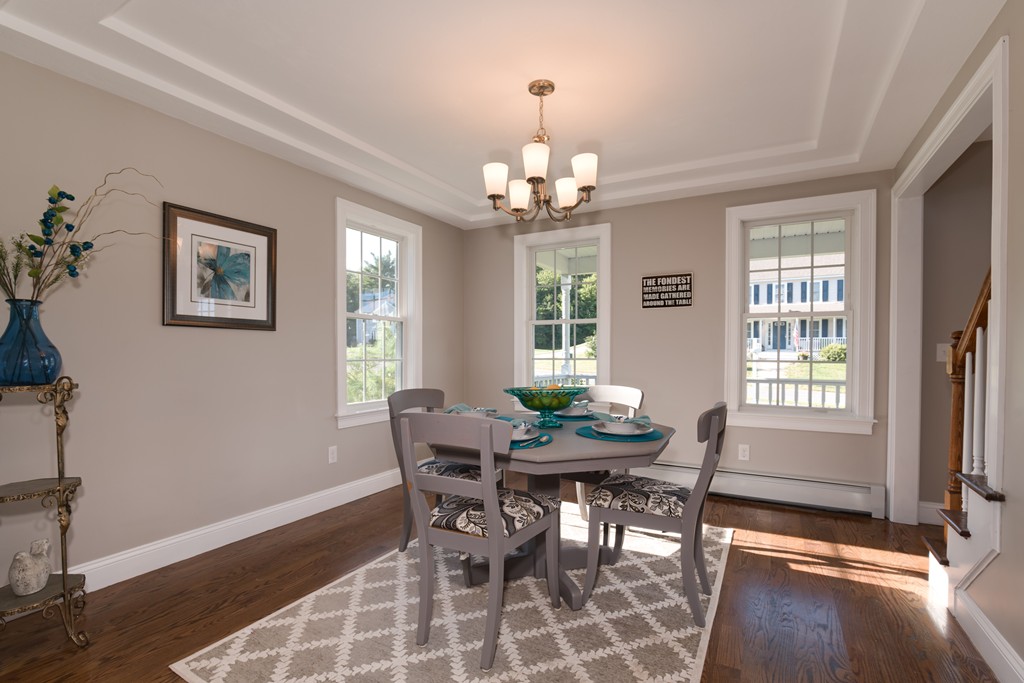 15 Winifreds Way Rutland, MA 01543 - Photo 8 of 30 a view of a dining room with furniture a chandelier and wooden floor