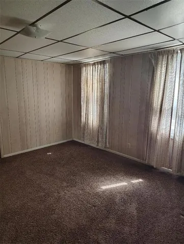 a view of empty room with windows