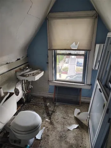 a bathroom with a toilet and a sink