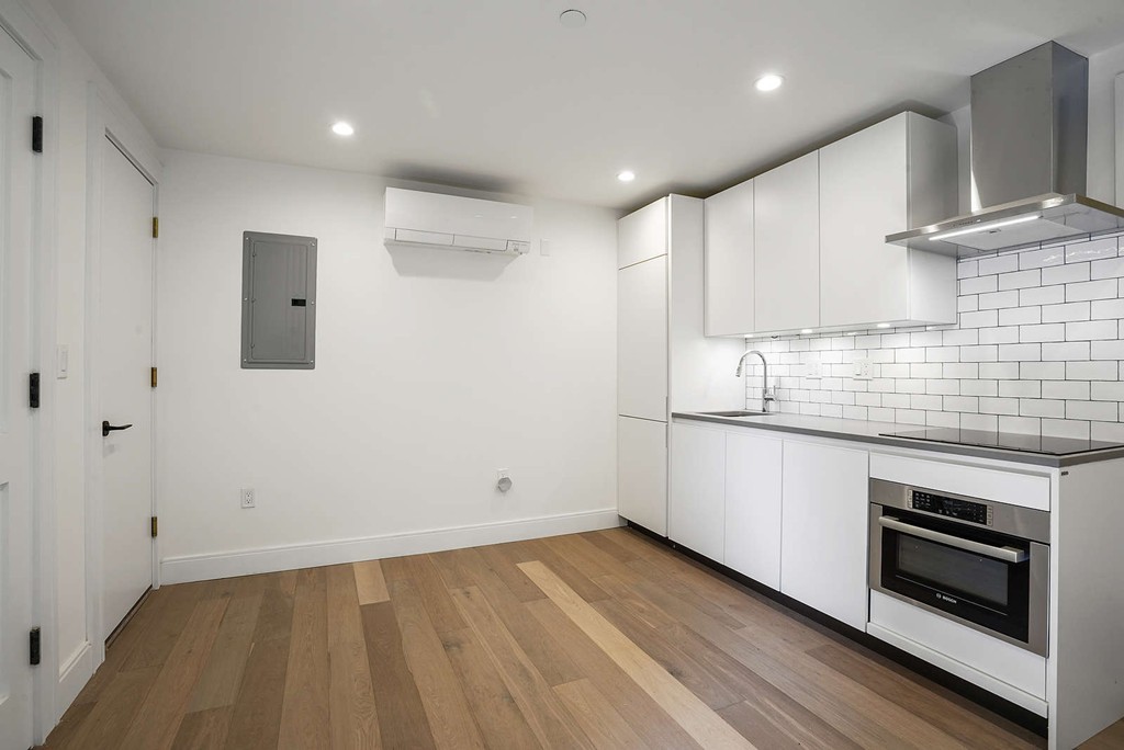 72 Beacon Street, Unit A Boston, MA 02108 - Photo 1 of 19 a kitchen with granite countertop a stove and a sink